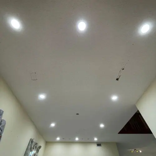 Smooth white ceiling with new recessed lights